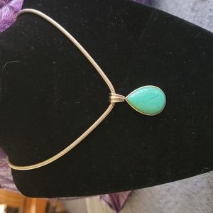 Sterling Silver pendant with synthetic turquoise stone. Chain not included.